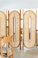 Tori Folding Screen is a three-panel room divider that balances structure and lightness through refined materials and clean proportions. Inspired by Japanese gateways symbolizing transition and welcome, it organizes space without enclosing it. The solid Australian hardwood frame provides warmth and stability, while natural rattan cane panels create semi-transparent surfaces that softly filter light.